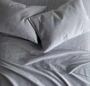 Peacock Alley Flannel sheets A set of gray Peacock Alley Flannel sheets on a bed.