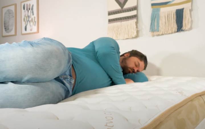 A man side sleeps on the Loom and Leaf mattress A man side sleeps on the Loom and Leaf mattress
