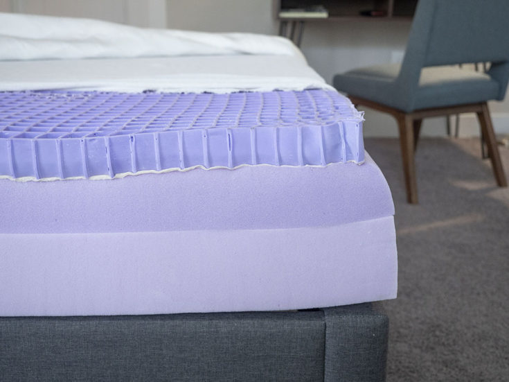 A mattress is opened to show its design.