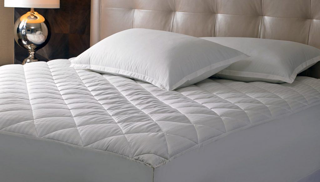 A mattress pad on a mattress