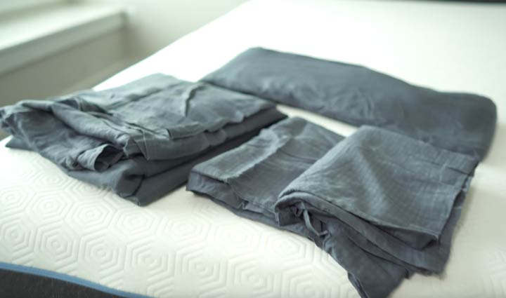 An image of the Casper Hyperlite Sheet set on a bed. These sheets might have the best thread count for sheets if you're looking for cooling sheets.