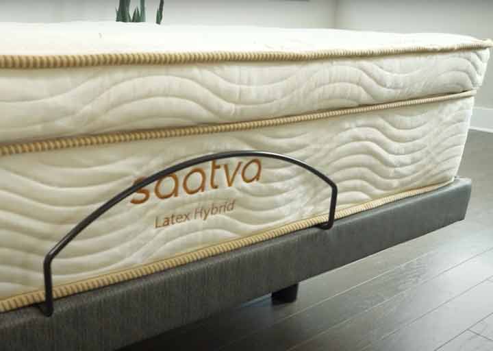 A close shot of the Saatva Latex Hybrid on top of the Saatva Lineal base A close shot of the Saatva Latex Hybrid on top of the Saatva Lineal base