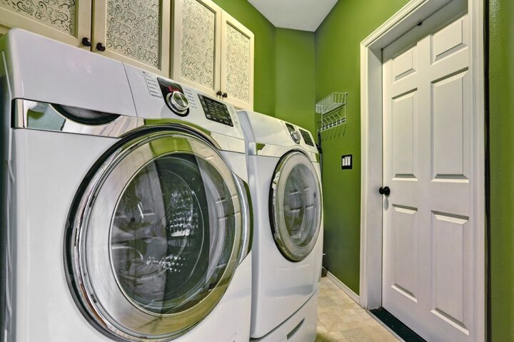 a washer and dryer in a green room