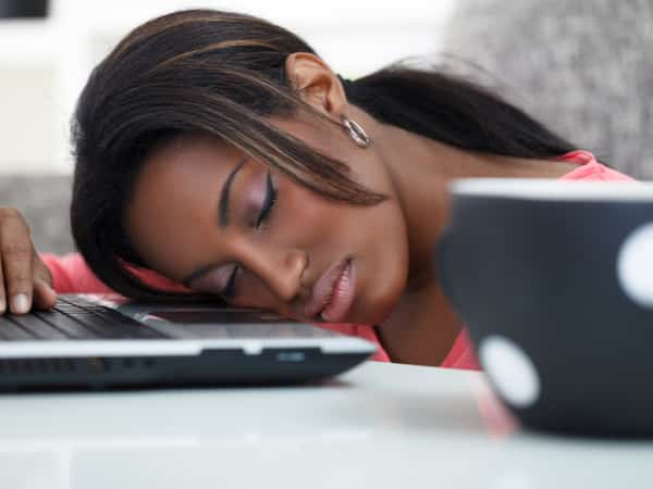 woman falling on her desk