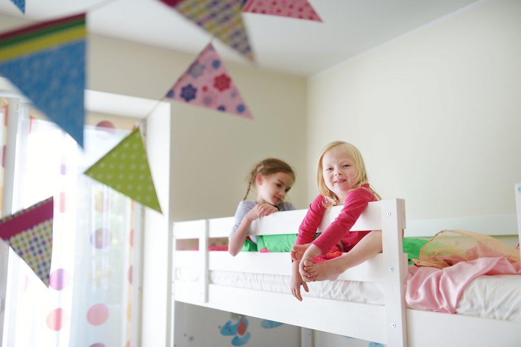 Kids in a twin size bunk bed