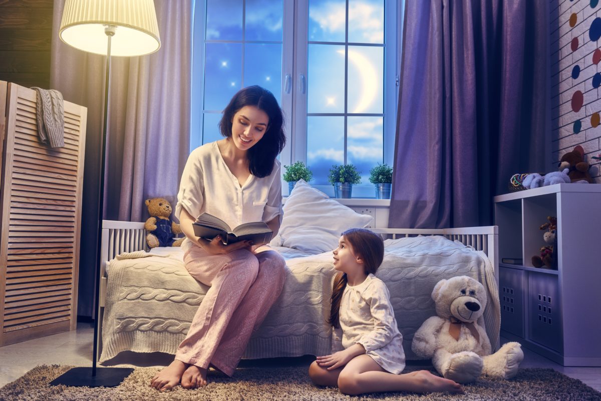 mom reading story to her daughter