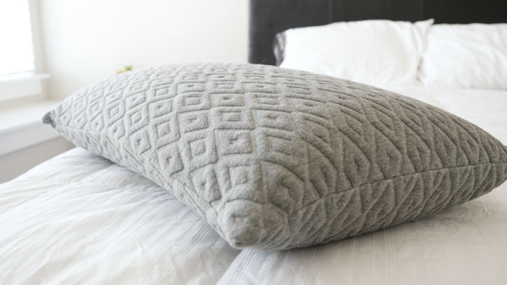 A Brooklyn Bedding Talalay Latex pillow sits on a bed. 