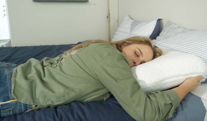 a woman rests on her stomach 