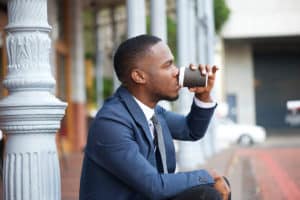 the effect of coffee on sleep; businessman drinking coffee