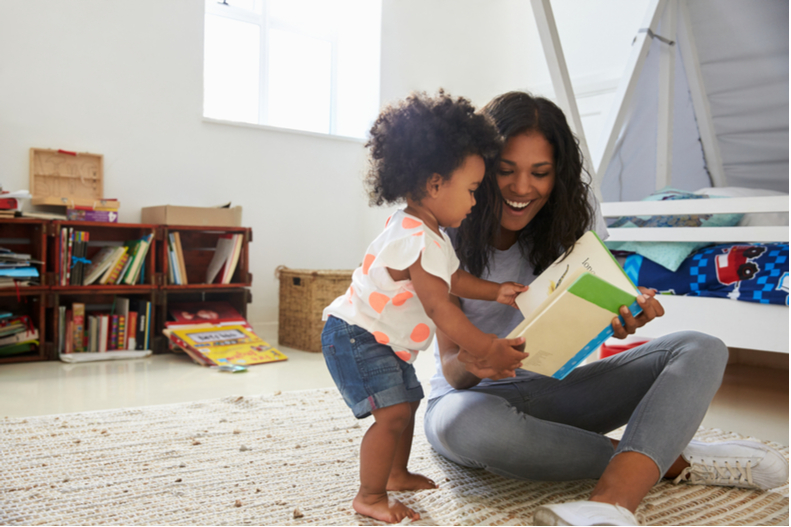 A woman reads a story to a child