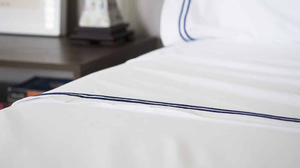 white sheets on a bed
