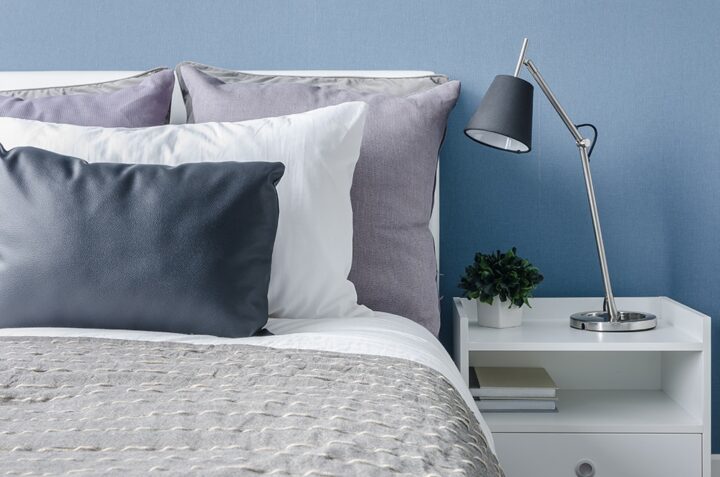 Bed in blue bedroom