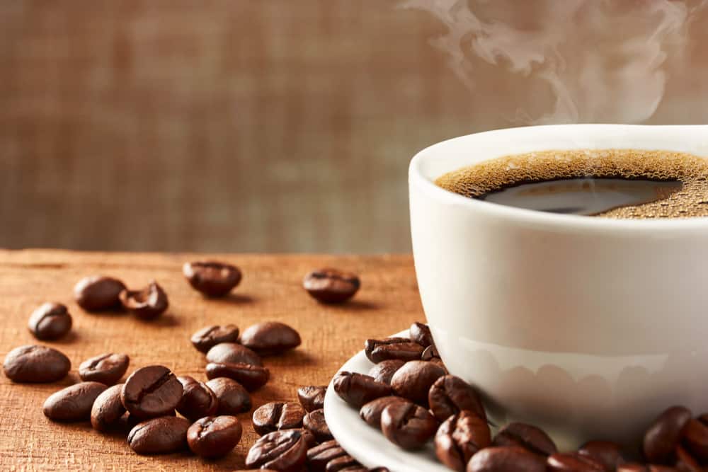 A close-up of a cup with beans.