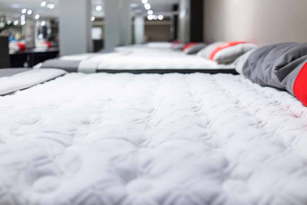 Numerous beds in a store. 
