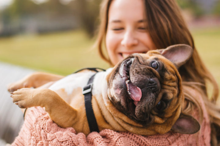 Woman holding dog