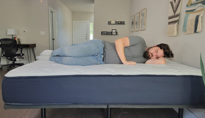 A man sleeps on his side on the Big Fig mattress