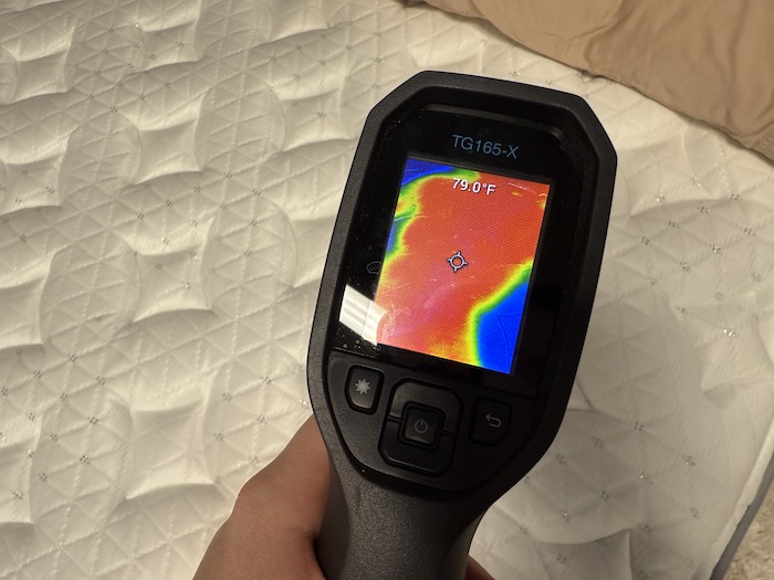 Taking a temperature reading after lying on the Helix Plus