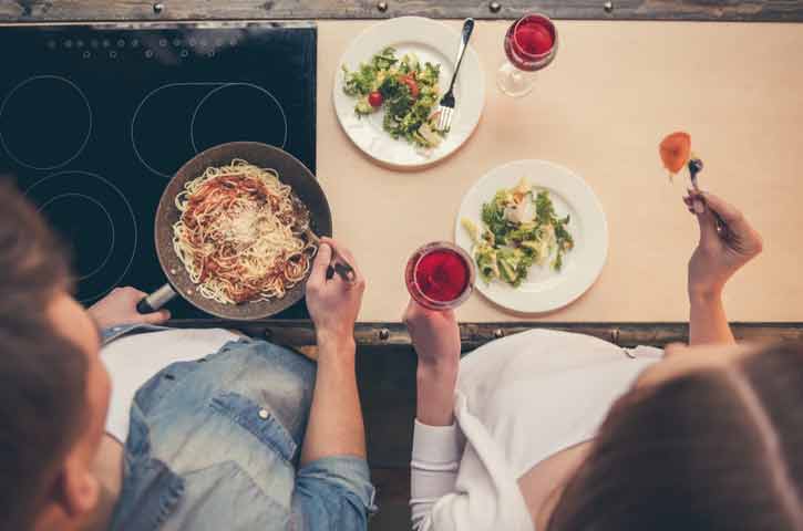 Overhead Shot Of A Couple Cooking