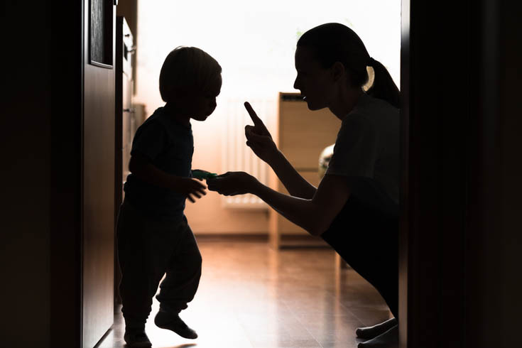 A mother scolds her child. 