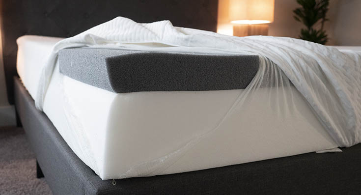 A mattress is opened to show its construction.