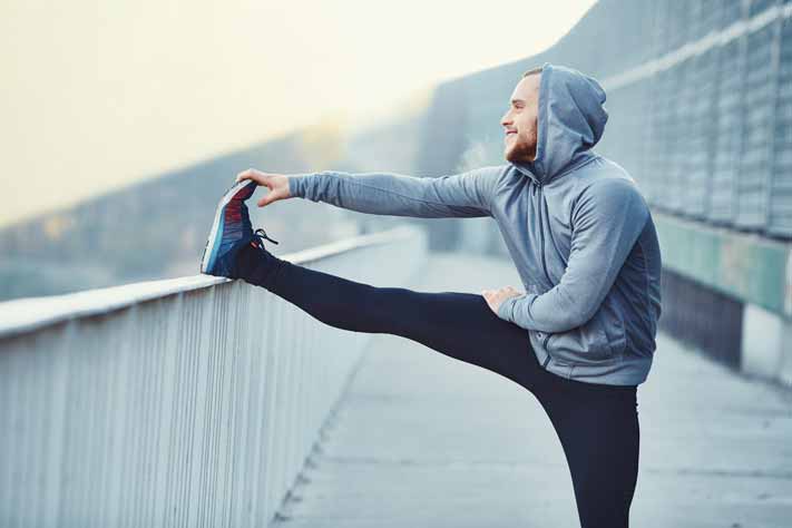 What's the Link Between Sleep and Exercise? exercise sleep man stretch edit