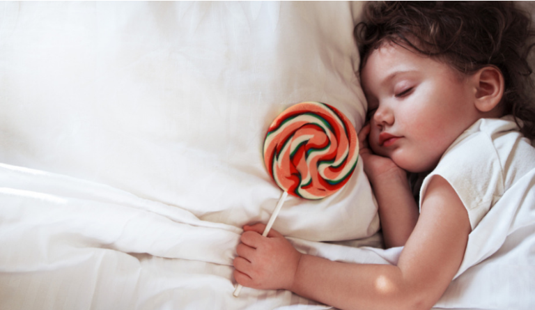 little girl sleeping with sugar
