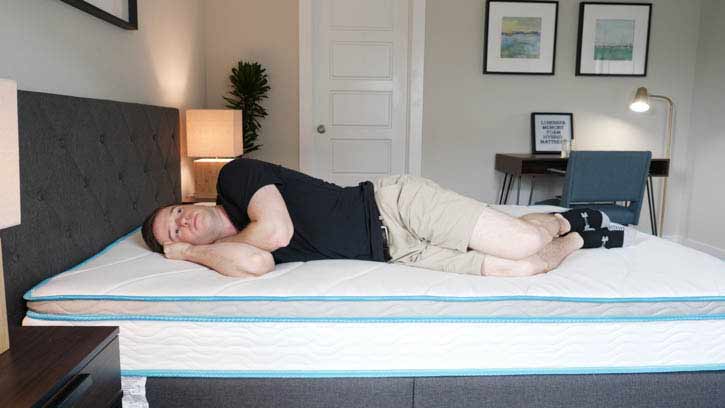 A man sleeps on his side.