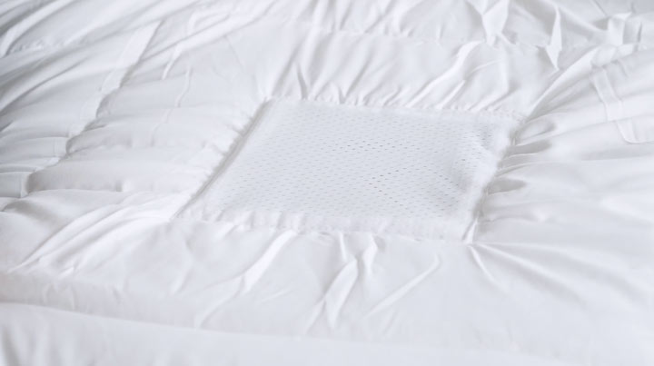 A close shot of the ClimaBalance comforter's hi-tech mesh squares.