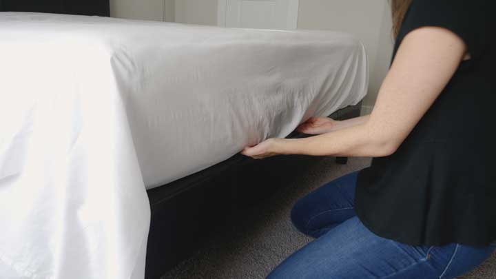 To make hospital corners you need to tuck the flat sheet into the foot of the bed