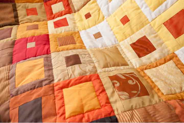 A colorful patchwork design quilt