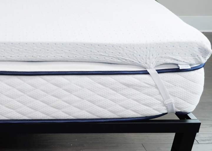 A mattress topper on a mattress