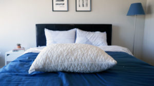 An image of the COOP home goods original pillow on a bed.