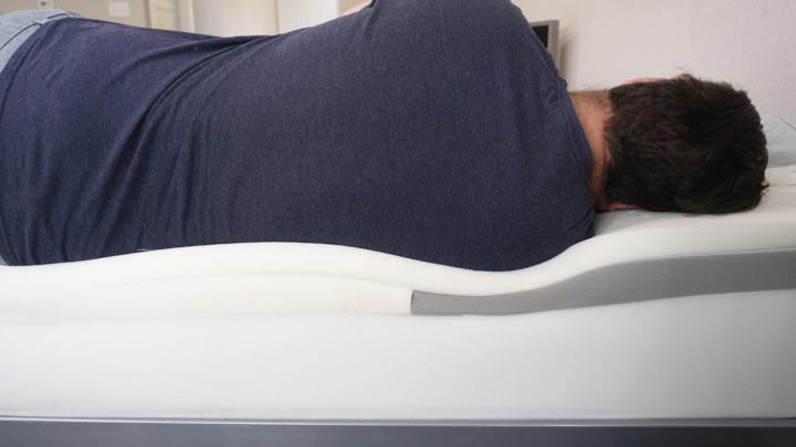 A man sleeps on his side on the Casper mattress
