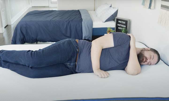 man laying on side on Nectar mattress