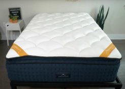 A wide shot of the DreamCloud Premier rest mattress on a bed frame