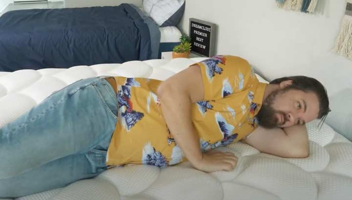 A man side sleeps on the DreamCloud Premier Rest