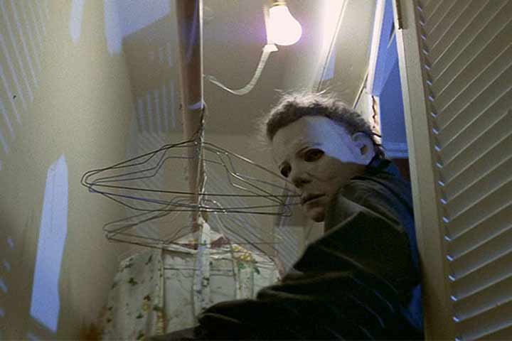A masked Michael Myers enters a closet