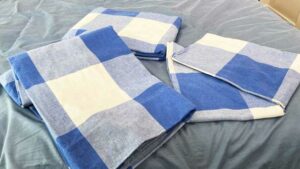 An image of the pieces that make up the Brooklinen Flannel Core Set placed on a bed. An image of the pieces that make up the Brooklinen Flannel Core Set placed on a bed.