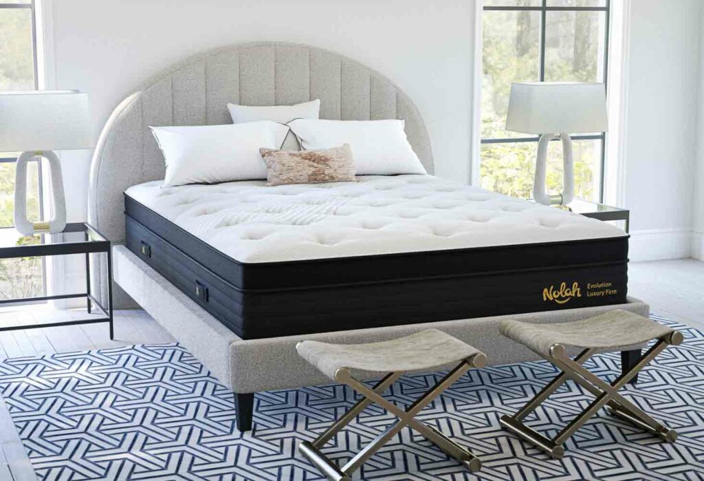 A wide shot of the Nolah Evolution Hybrid in a modern bedroom.