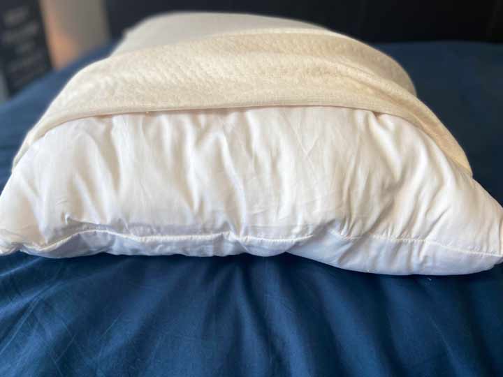 The cover of the Birch pillow is pulled back to reveal the inner pillow.