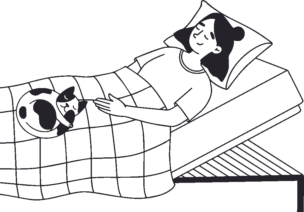 Frau in einem verstellbaren Bett mit ihrer Katze