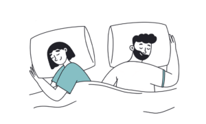 couple sleeping happily in bed