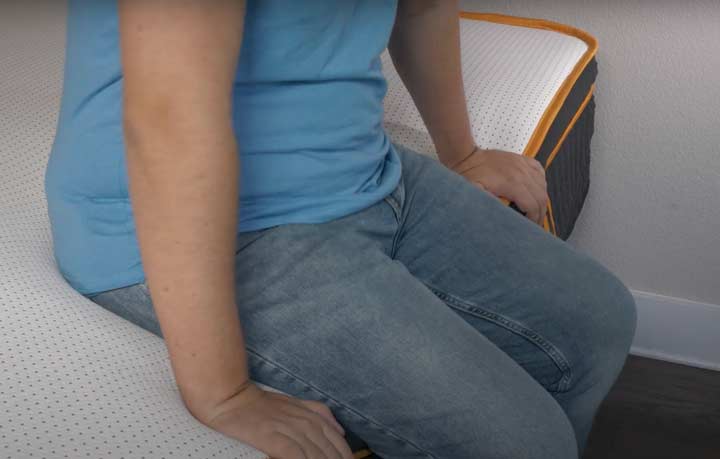 A man sits near the edge of the Nectar Premier Copper Hybrid