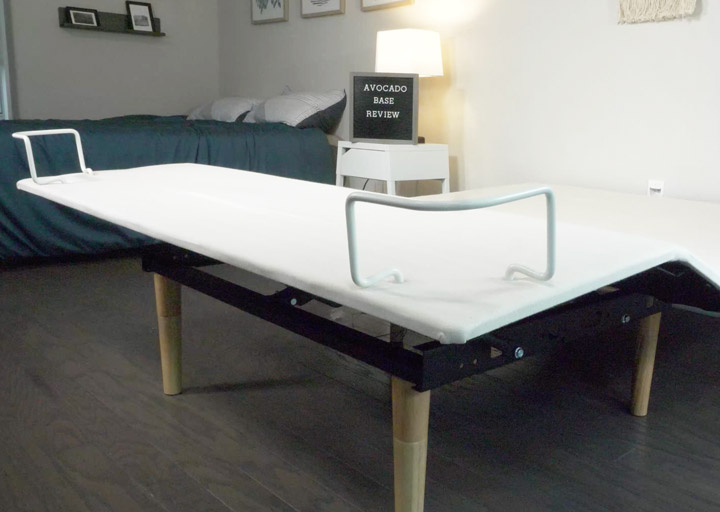 A wide shot of a white adjustable base with the foot area raised