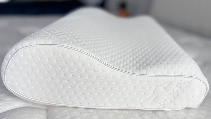 A close up picture showing off the ergonomic shape to the TEMPUR-Neck pillow.