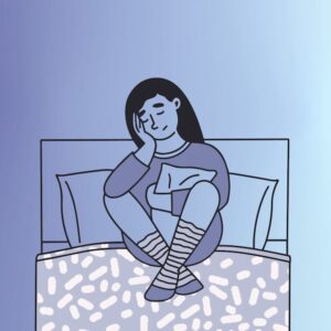 woman worrying in bed
