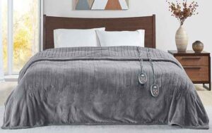 An image of the Beautyrest electric blanket in gray on a bed.