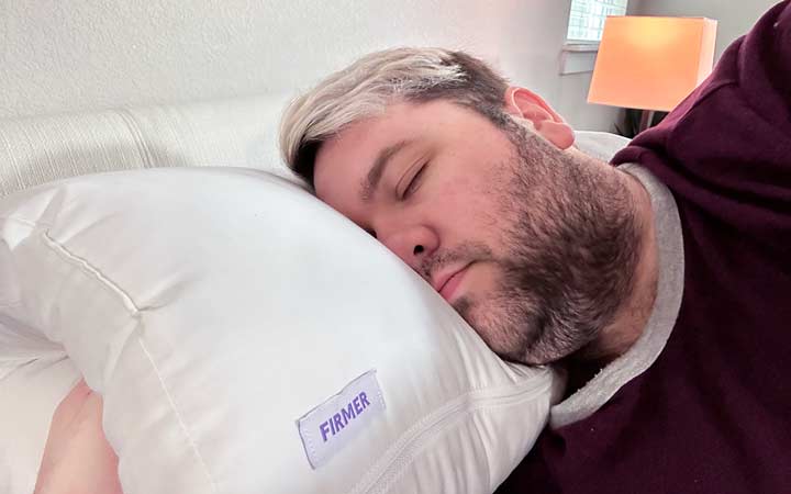 A man rests on his side using the Purple TwinCloud pillow