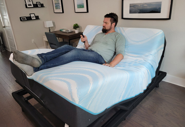 A man uses the Zero Gravity feature on the Brooklyn Bedding Adjustable Base