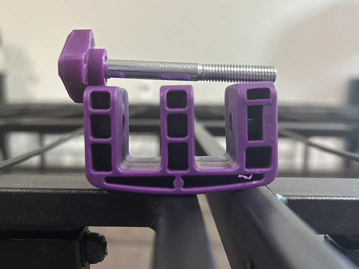 A close up image of the pieces that attach the Purple Platform bed frame.